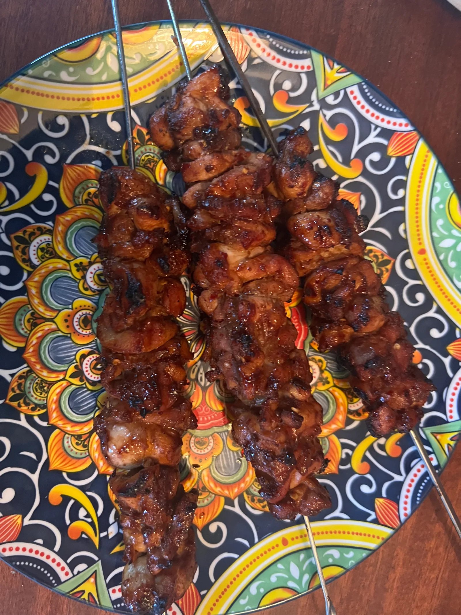 Asian chicken kebabs plated.