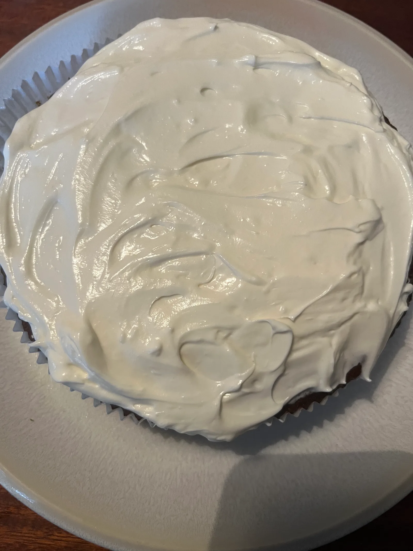 A carrot cake with cream cheese frosting.