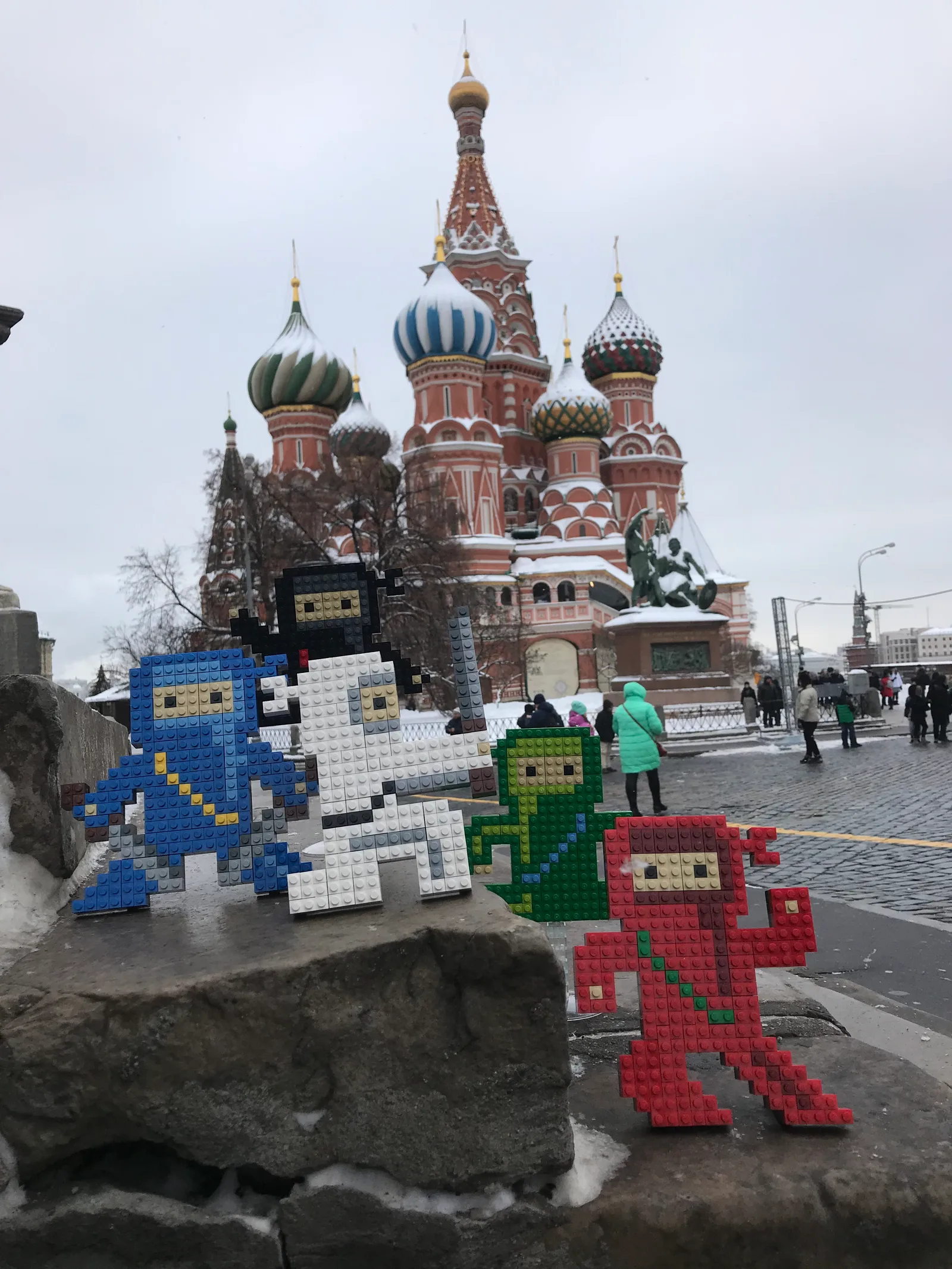 The Lego ninjas lined up before Saint Basil's Cathedral, snow on the domes.