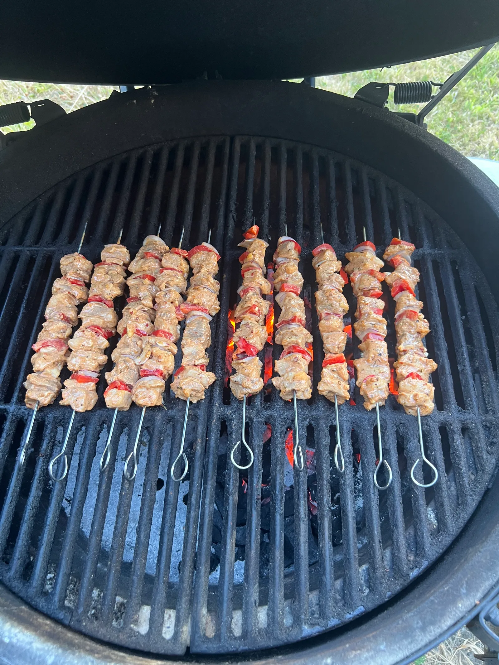 Pork souvlaki skewers on the grill.